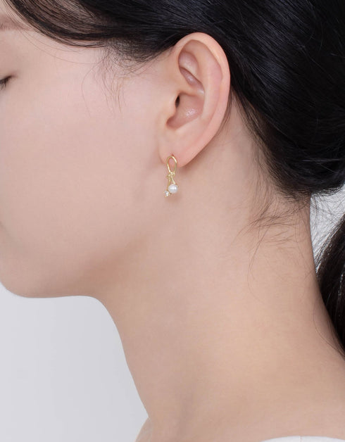 Lustrous Pearl & CZ Knot Stud Earrings - Elegant design